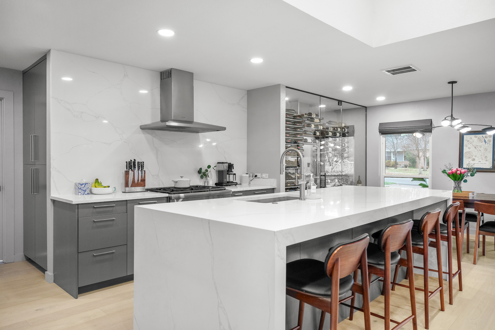 Luxury kitchen remodel with marble slab backsplash